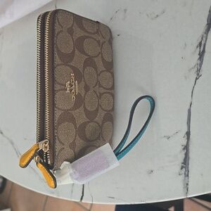 Coach Signature Brown Wristlet with Blue Strap